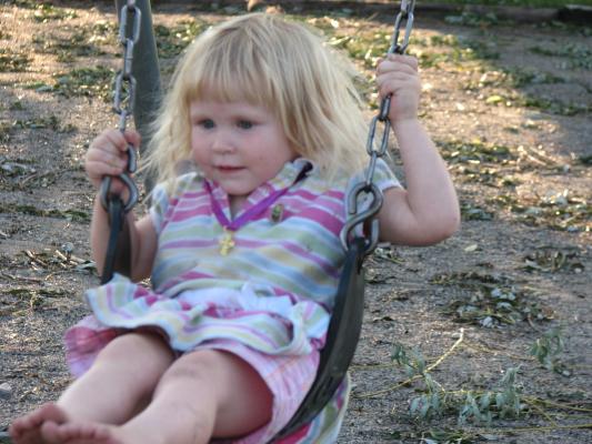 Sarah in a swing.
