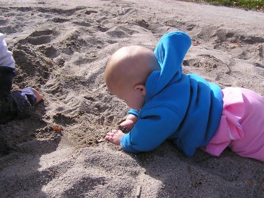 Sarah plays in the sand