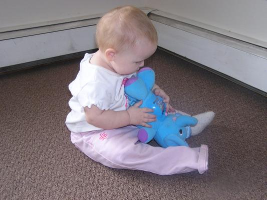 Sarah plays with her new elephant.