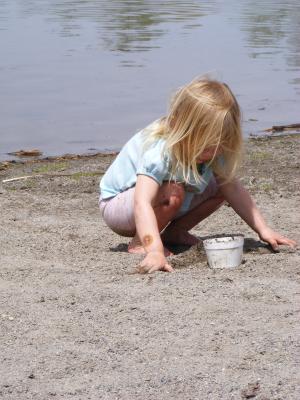 Sarah plays in the sand at Bozeman Pond beach.