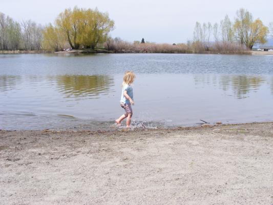 Sarah plays in the water at Bozeman Pond.