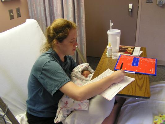 Katie fills out paperwork to go home