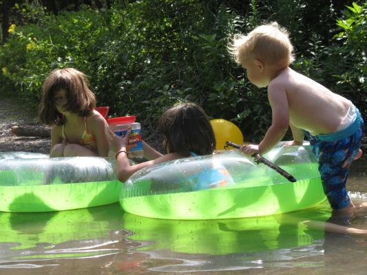 Andrea, Malia, and Noah play in the lake.