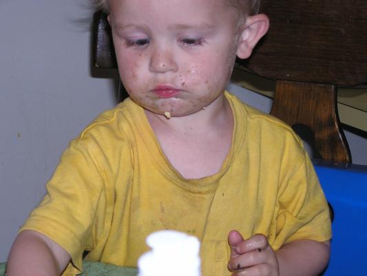 Noah eats some birthday cake with sprinkes too.