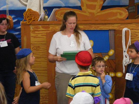 Katie E. giving out VBS awards.