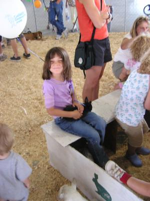Andrea holds a bunny at the fair.