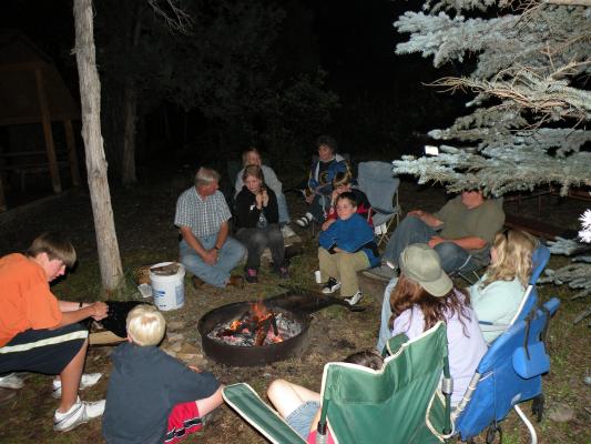 GVCC members and friends gather around the campfire.