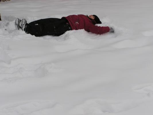 Andrea makes a snow angel.