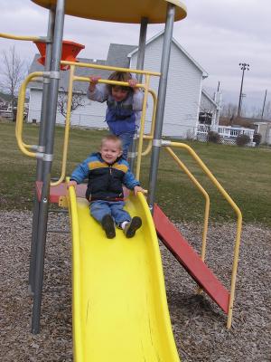 Noah and Mickala play at the park before the Easter egg hunt.