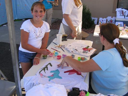 Sarah paints her shirt for VBS.