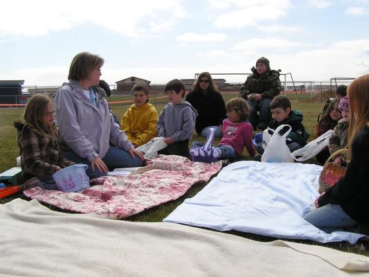 Deb tells the story of Easter to the kids using Resurrection Eggs.