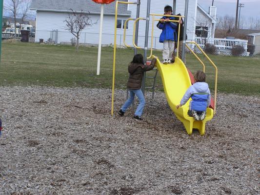 Kids play at the park before the Easter egg hunt.
