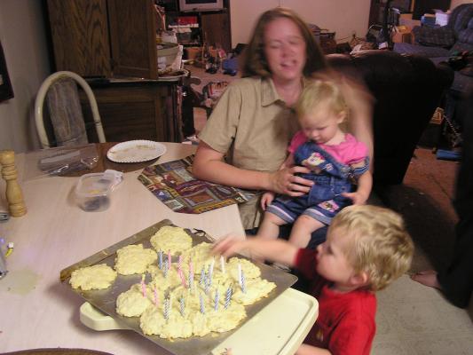 Noah is ready to eat Mom's birthday cake