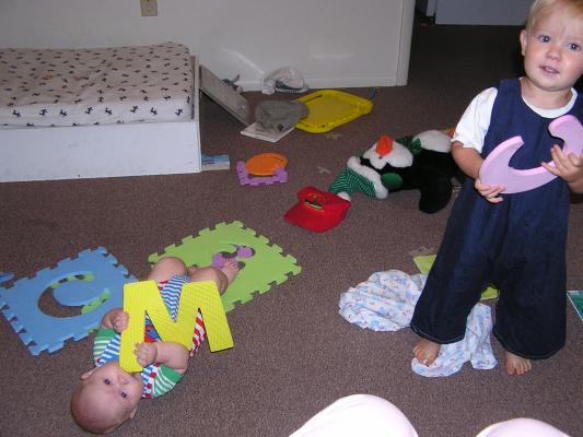 Sarah and Noah play with the foam letters.