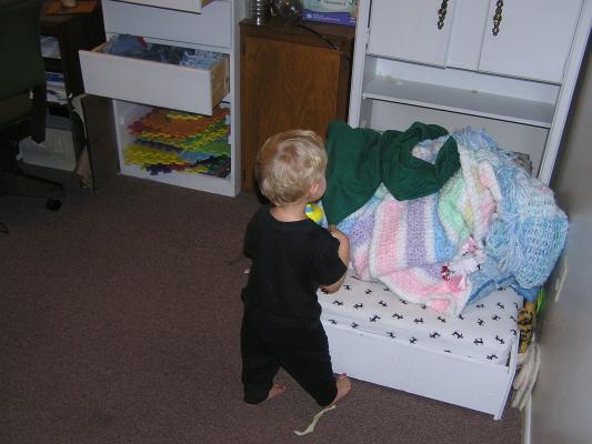 Noah likes to play with blankets in his bed
(but not use them).