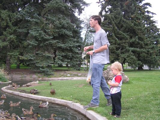 David and Noah feed the ducks.