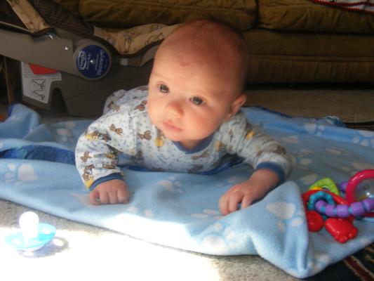 Joshua on a blue blanket.