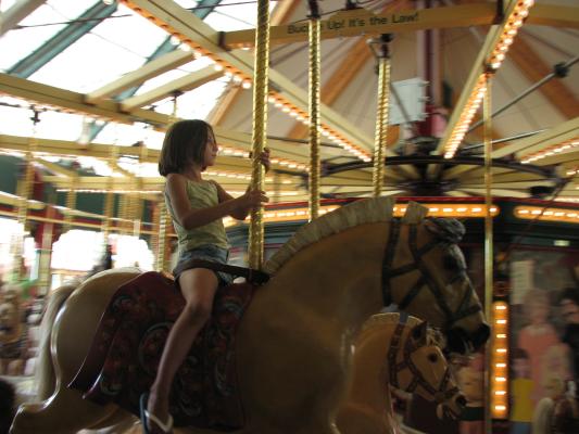 Andrea on a Carousel horse.