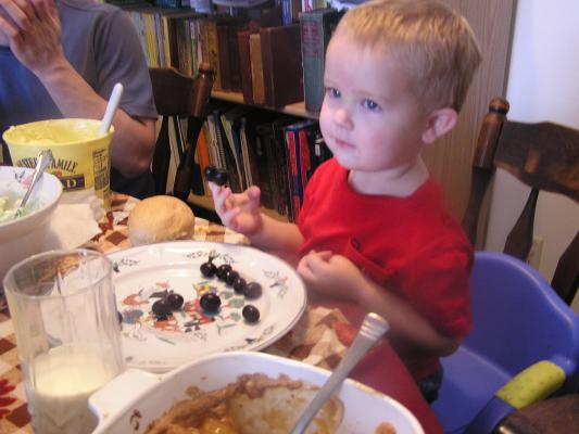 Noah eats thanksgiving dinner (olives).