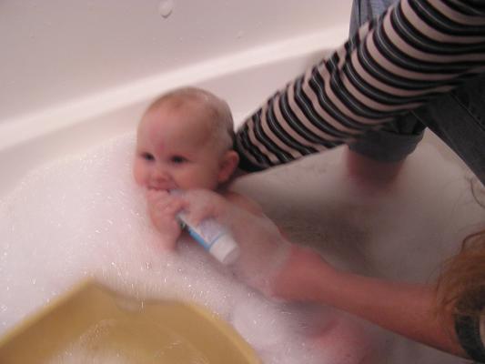 Sarah takes a bubble bath.