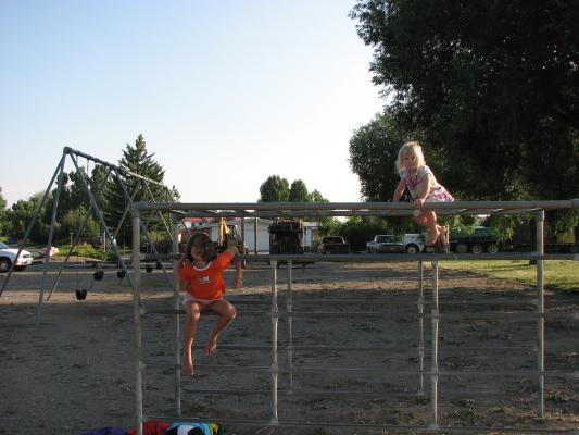Andrea and Sarah on the monkey bars.